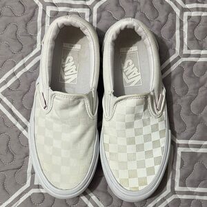 Vans men’s White Checkered Slip-On Sneakers.